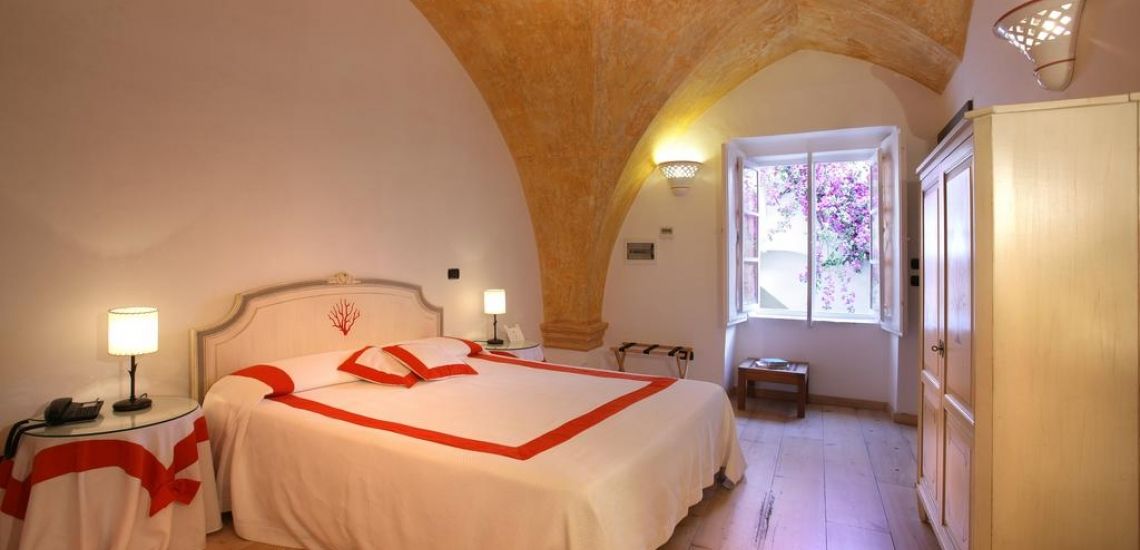 Op de ruime kamers van Relais Corte Palmieri is het goed uitrusten van je Italië rondreis
