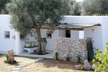 I Mulicchi kamer met terrasje onder olijfboom